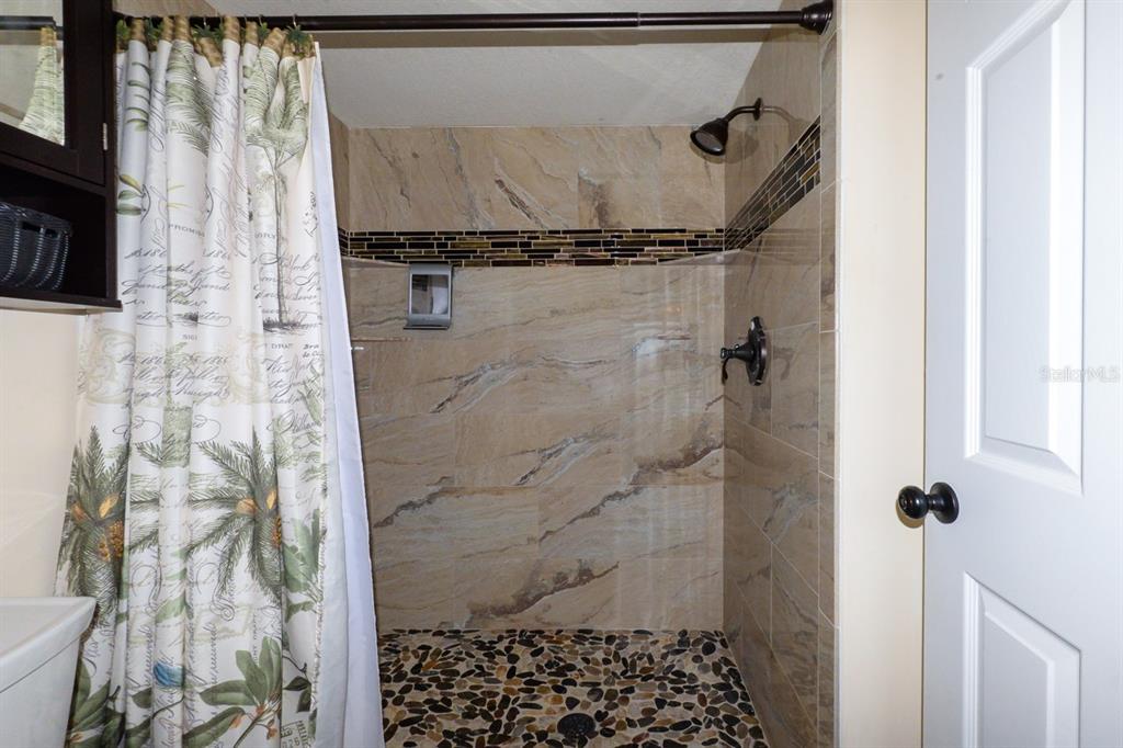 335 Coldeway Drive, Unit F21 Punta Gorda, FL 33950 - Photo 30 of 45 a bathroom with a shower