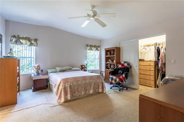 a bed room with a bed and a desk