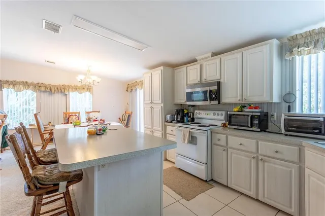 a kitchen with cabinets a sink and appliances