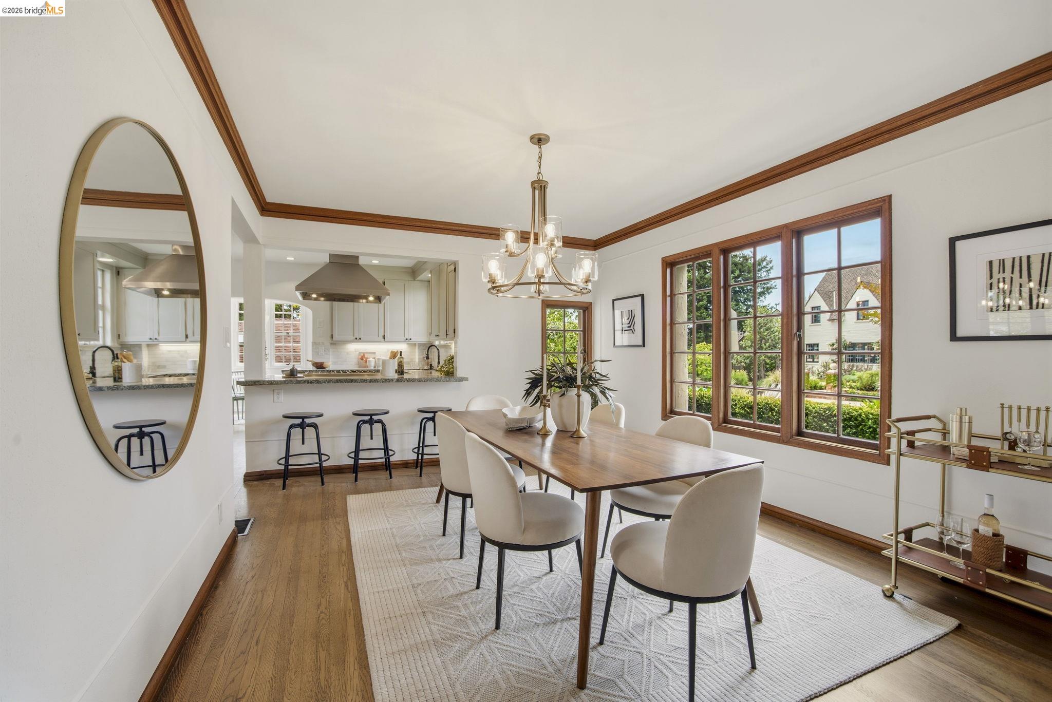 1087 Hubert Road Oakland, CA 94610 - Photo 10 of 67 Dining area featuring wood-finish flooring, white walls, and a recessed ceiling with wood trim