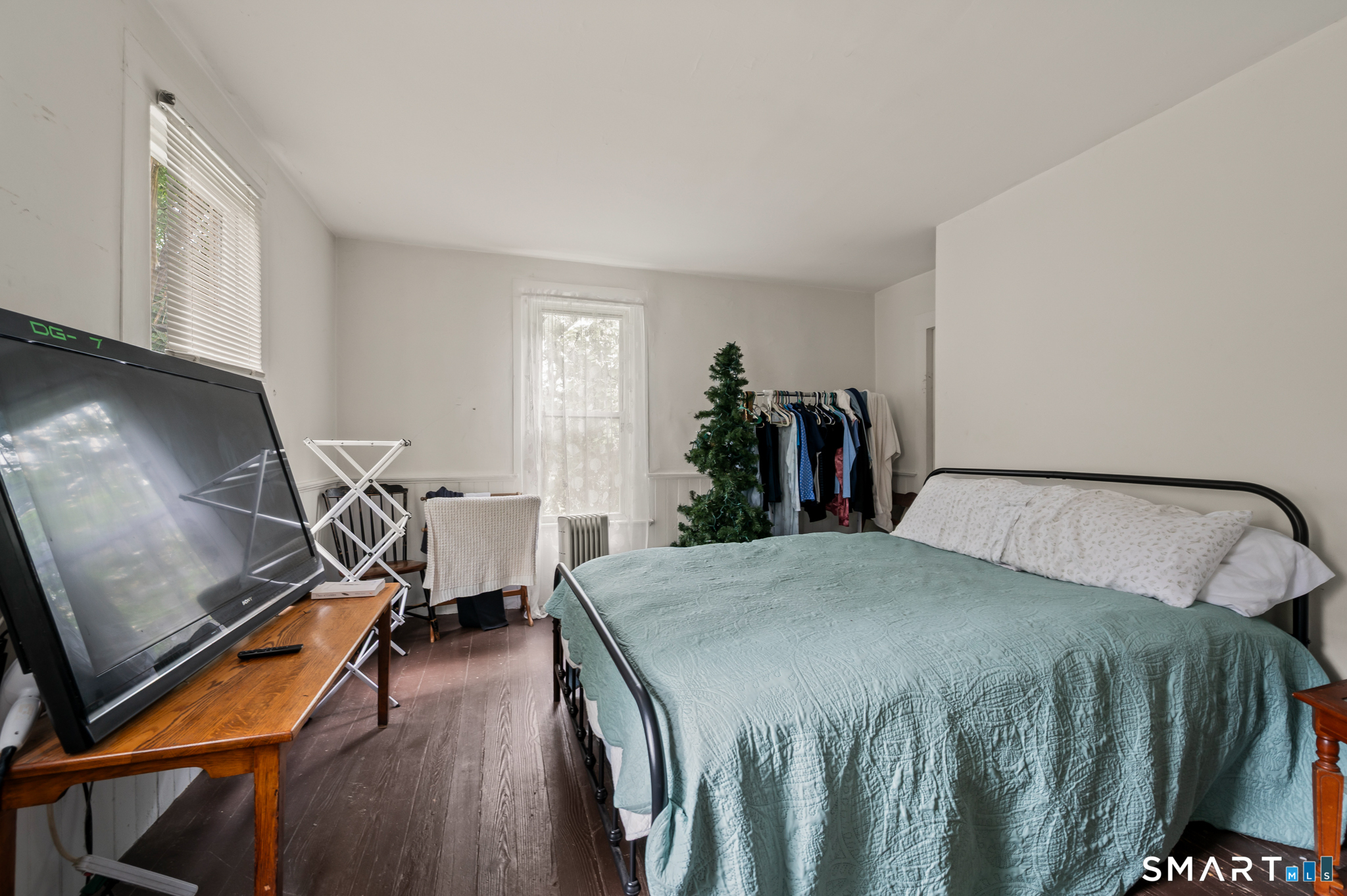 220 Murray Street Meriden, CT 06450 - Photo 19 of 28 a bed room with a bed and gym equipment