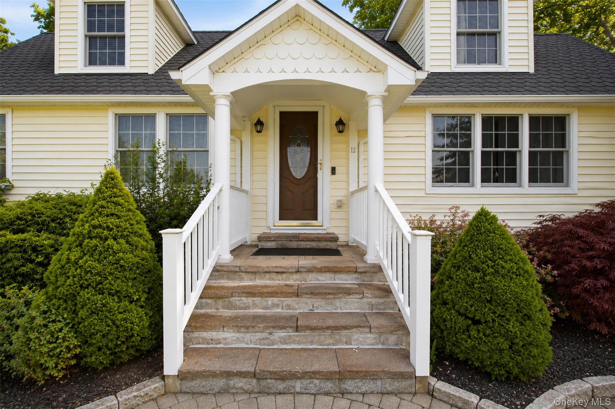 12 Leeside Road Carmel, NY 10512 - Photo 4 of 44 Siding exterior featuring a portico entry with white columns and railings