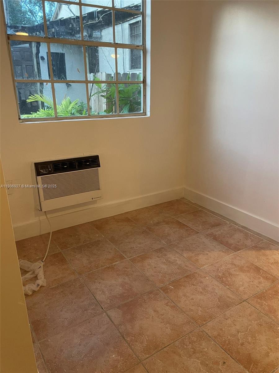 746 Northeast 80th Street, Unit GAR Miami, FL 33138 - Photo 12 of 14 a room with a window