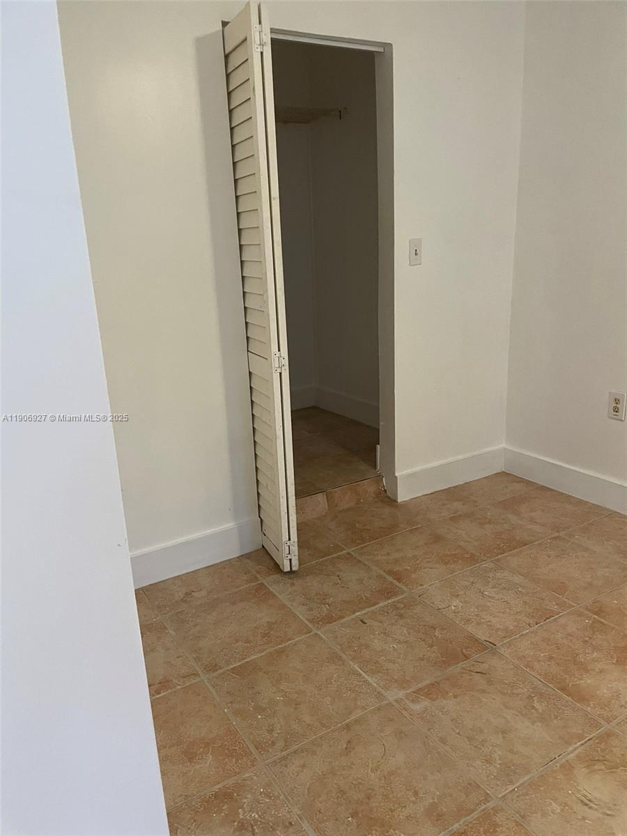 746 Northeast 80th Street, Unit GAR Miami, FL 33138 - Photo 10 of 14 an empty room with windows