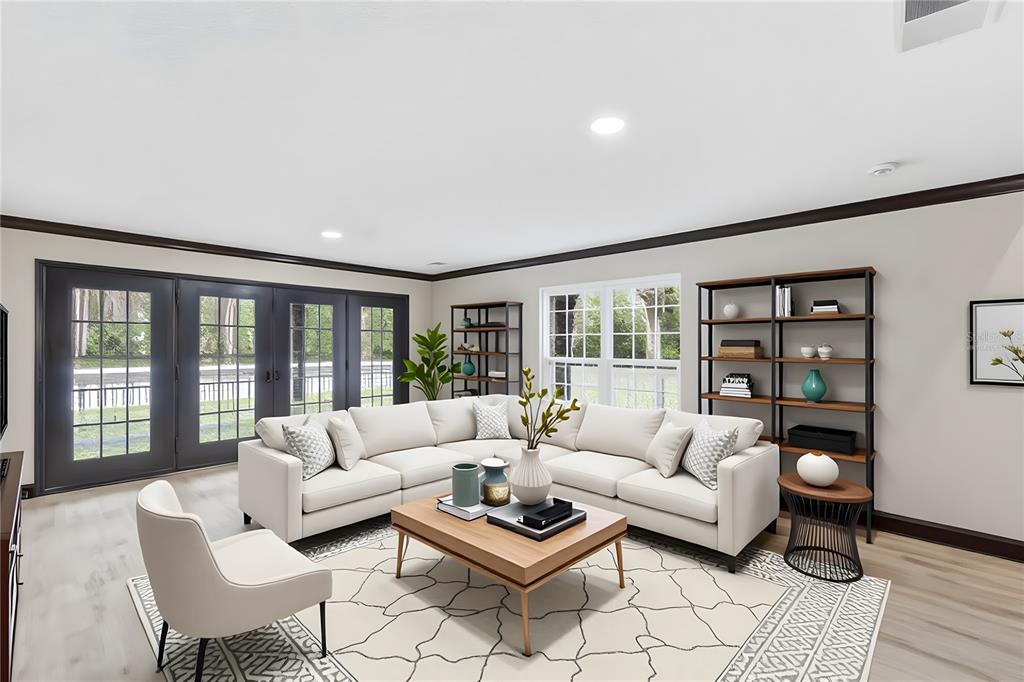 14728 Henson Road Orlando, FL 32832 - Photo 78 of 79 a living room with furniture and a floor to ceiling window
