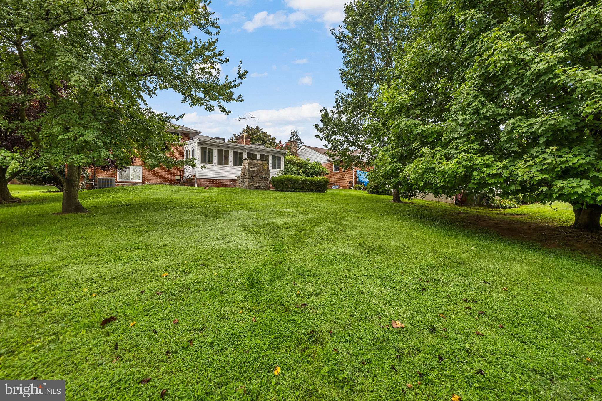 1304 Heather Hill Road Baltimore, MD 21239 - Photo 38 of 40 a view of a house with a big yard