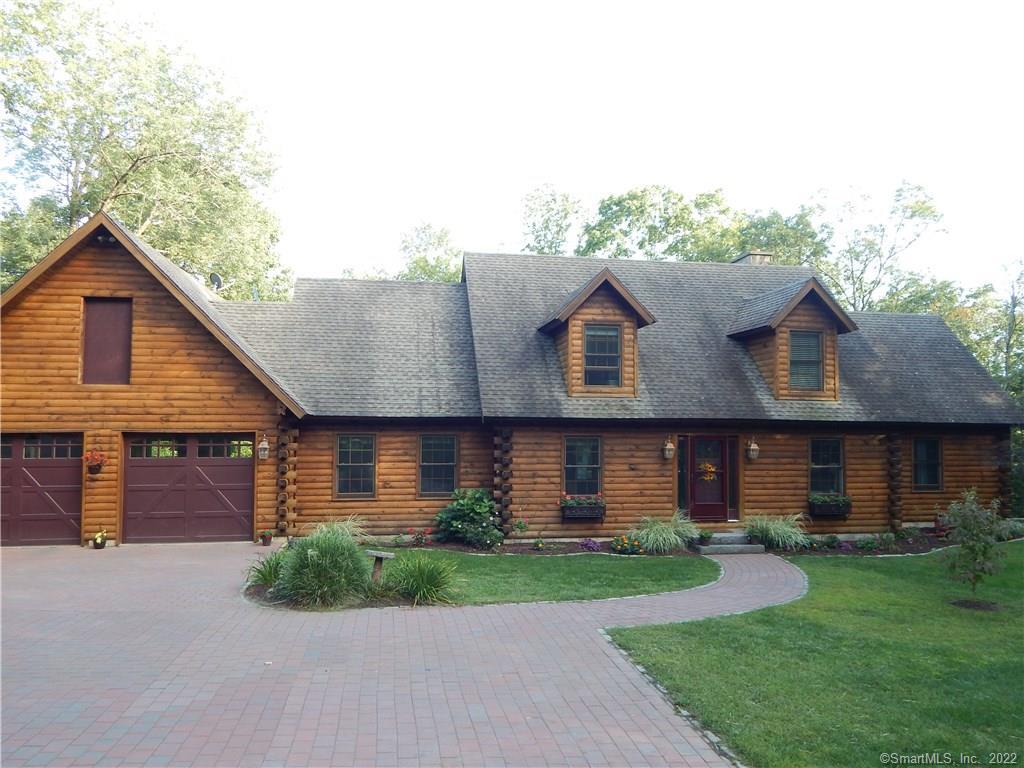 27 Gates Farm Road Lebanon, CT 06249 - Photo 1 of 1 a front view of a house with a yard and garage