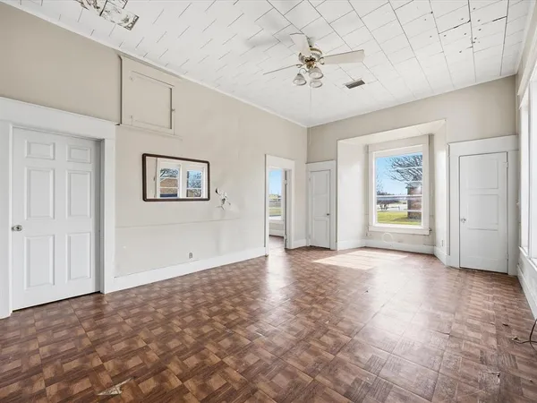 a view of an empty room with a window