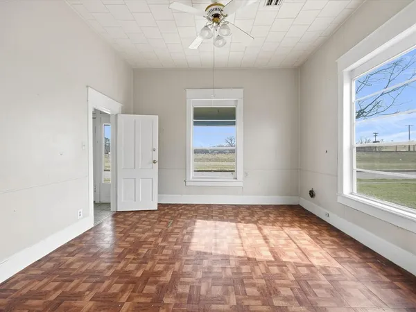 a view of an empty room with a window