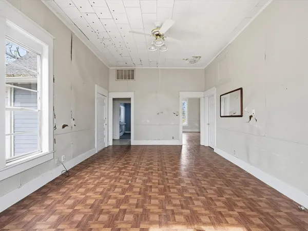 a view of an empty room with a window