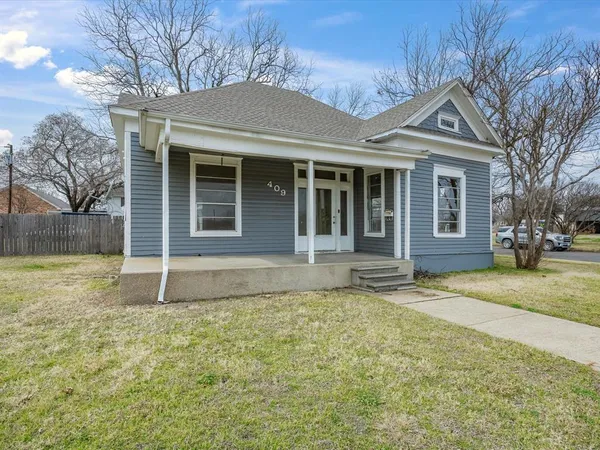 a house with trees in the background