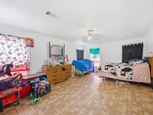a bed room with furniture and a flat screen tv