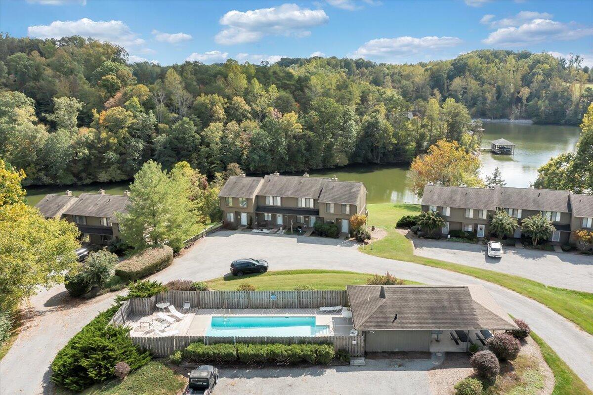 301 Harbor Ridge Drive Goodview, VA 24095 - Photo 2 of 56 an aerial view of a house with a swimming pool outdoor seating and yard