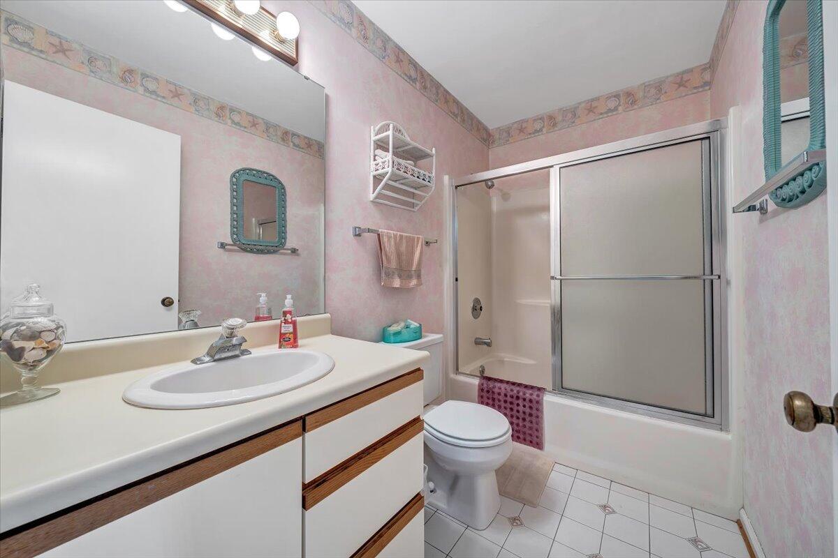 301 Harbor Ridge Drive Goodview, VA 24095 - Photo 15 of 56 a bathroom with a sink toilet and shower