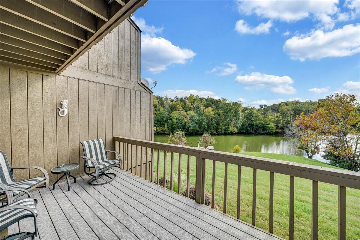 301 Harbor Ridge Drive Goodview, VA 24095 - Photo 23 of 56 a view of balcony with wooden floor and fence
