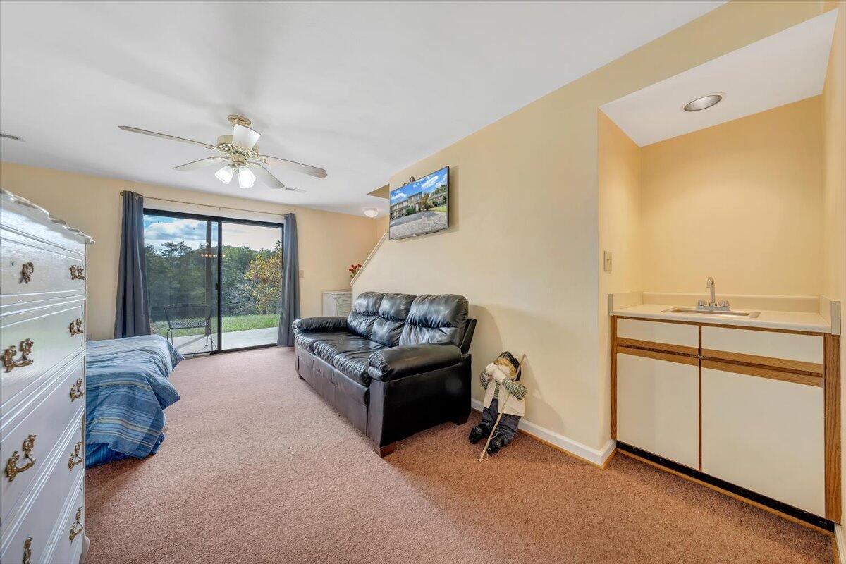301 Harbor Ridge Drive Goodview, VA 24095 - Photo 25 of 56 a bedroom with furniture and a window