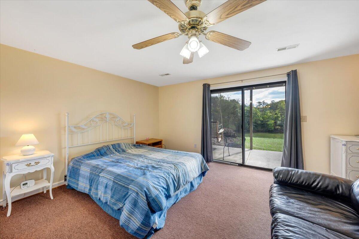 301 Harbor Ridge Drive Goodview, VA 24095 - Photo 26 of 56 a bedroom with a bed and a window