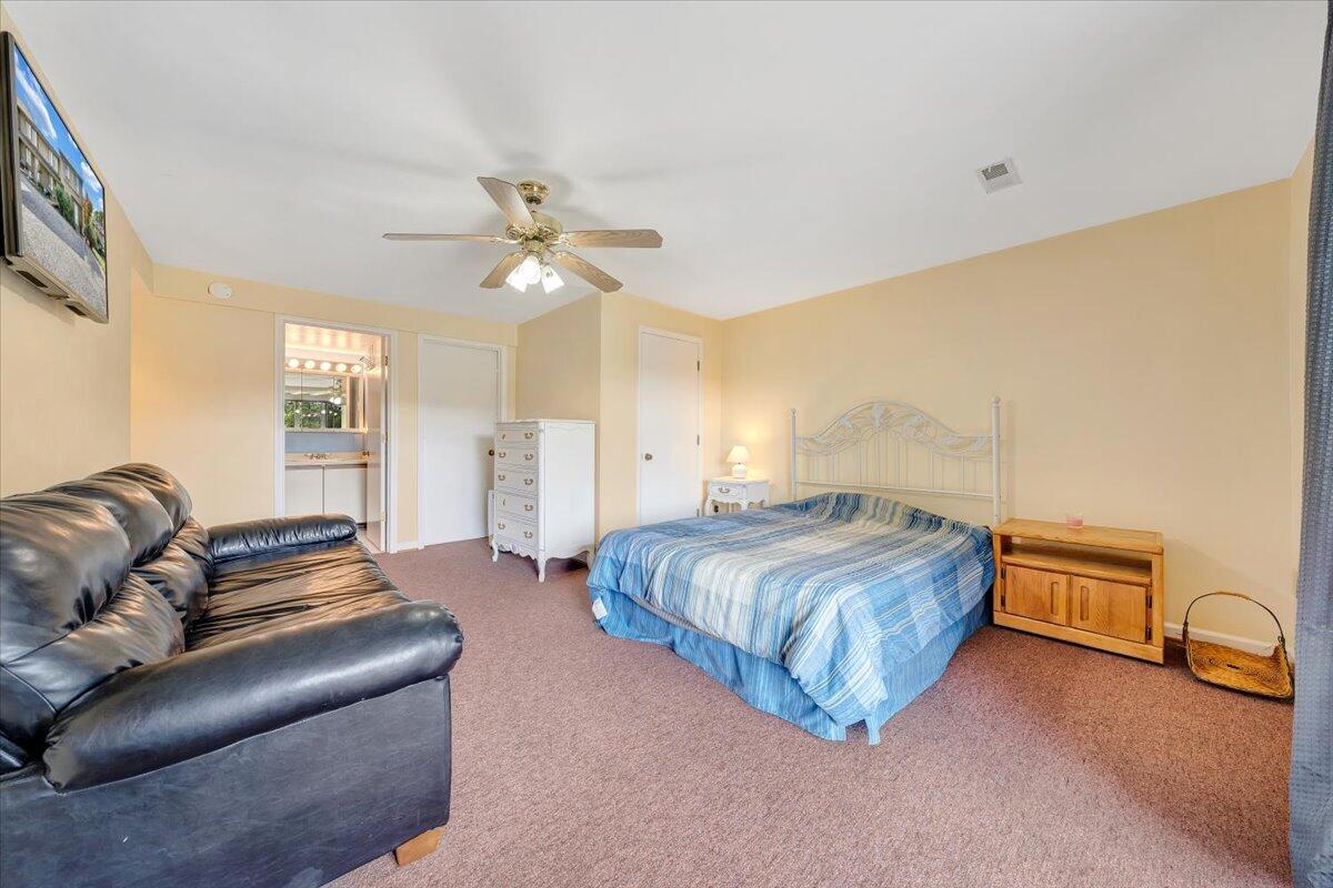 301 Harbor Ridge Drive Goodview, VA 24095 - Photo 28 of 56 a bedroom with a bed couch and window