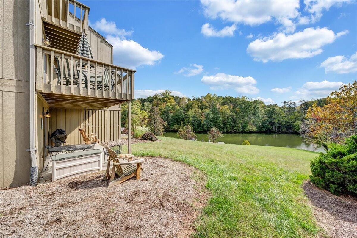 301 Harbor Ridge Drive Goodview, VA 24095 - Photo 30 of 56 a view of backyard with barbeque grill and stairs