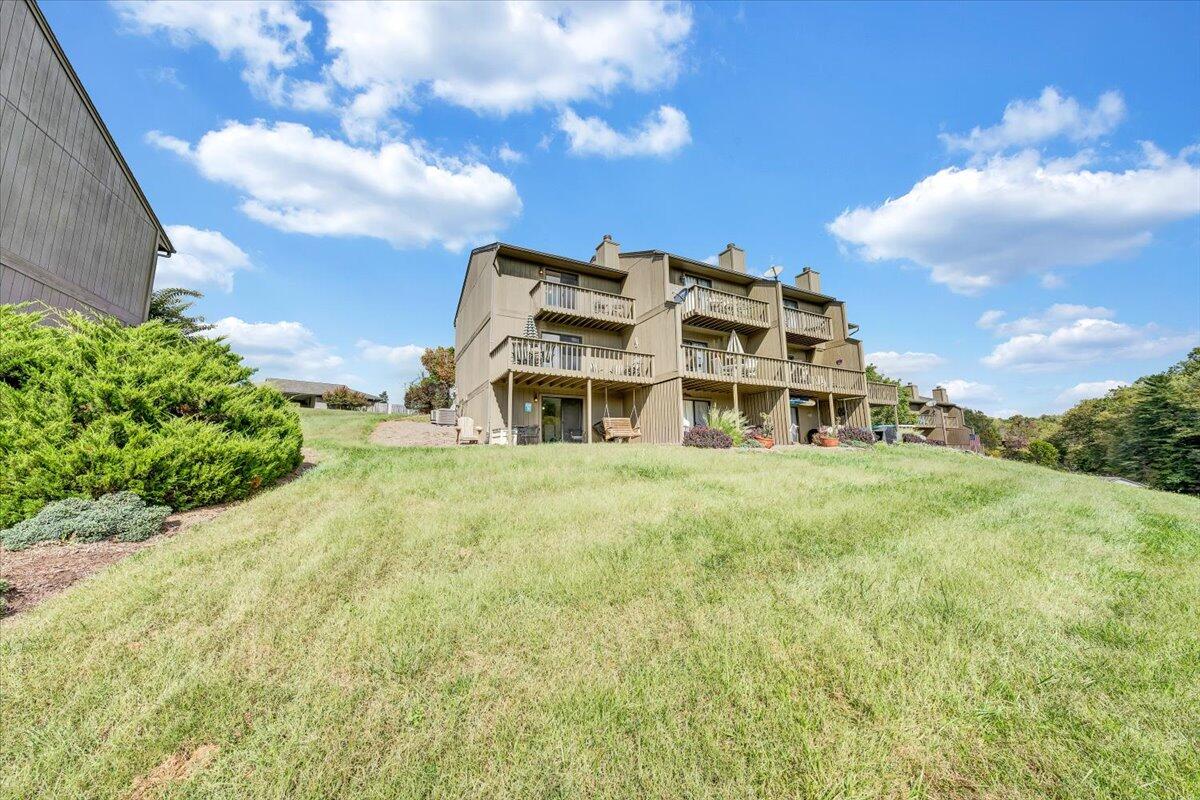 301 Harbor Ridge Drive Goodview, VA 24095 - Photo 31 of 56 a view of a tall building with a big yard