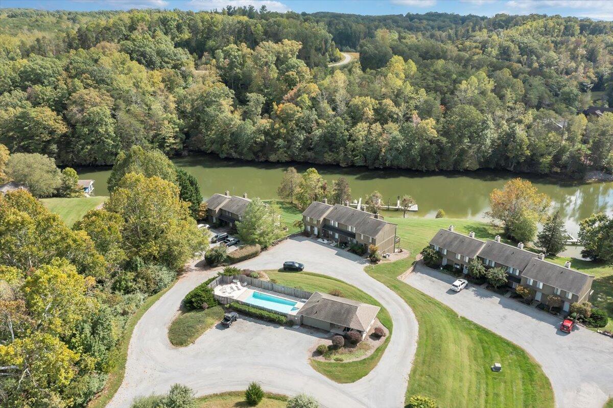 301 Harbor Ridge Drive Goodview, VA 24095 - Photo 41 of 56 an aerial view of a house with a swimming pool patio and lake view