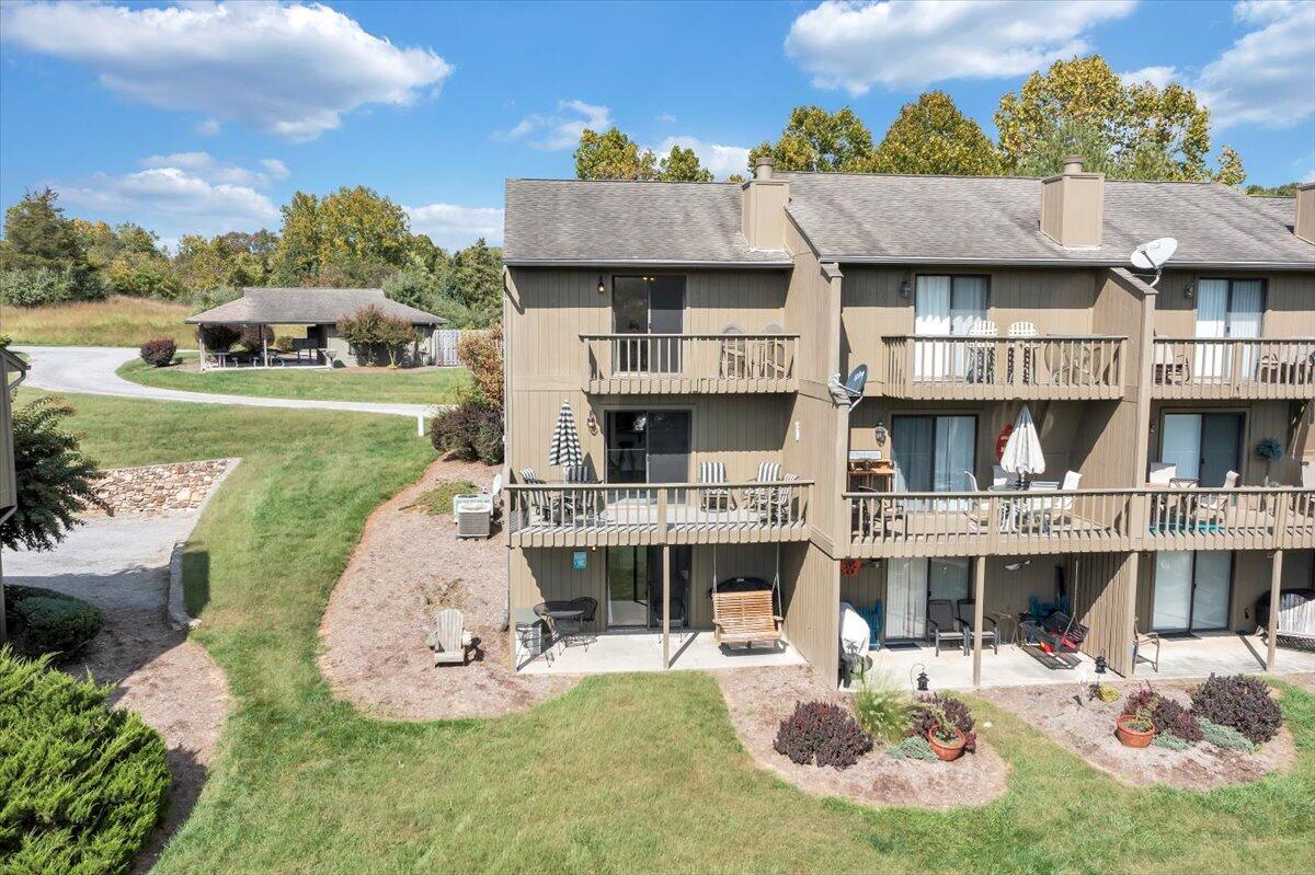 301 Harbor Ridge Drive Goodview, VA 24095 - Photo 53 of 56 a aerial view of a house with a garden and plants