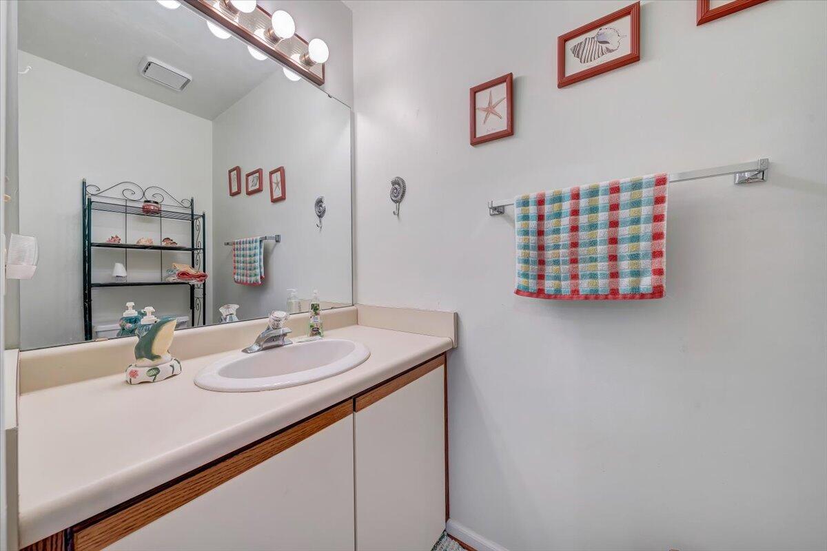 301 Harbor Ridge Drive Goodview, VA 24095 - Photo 10 of 56 a bathroom with a sink and a mirror
