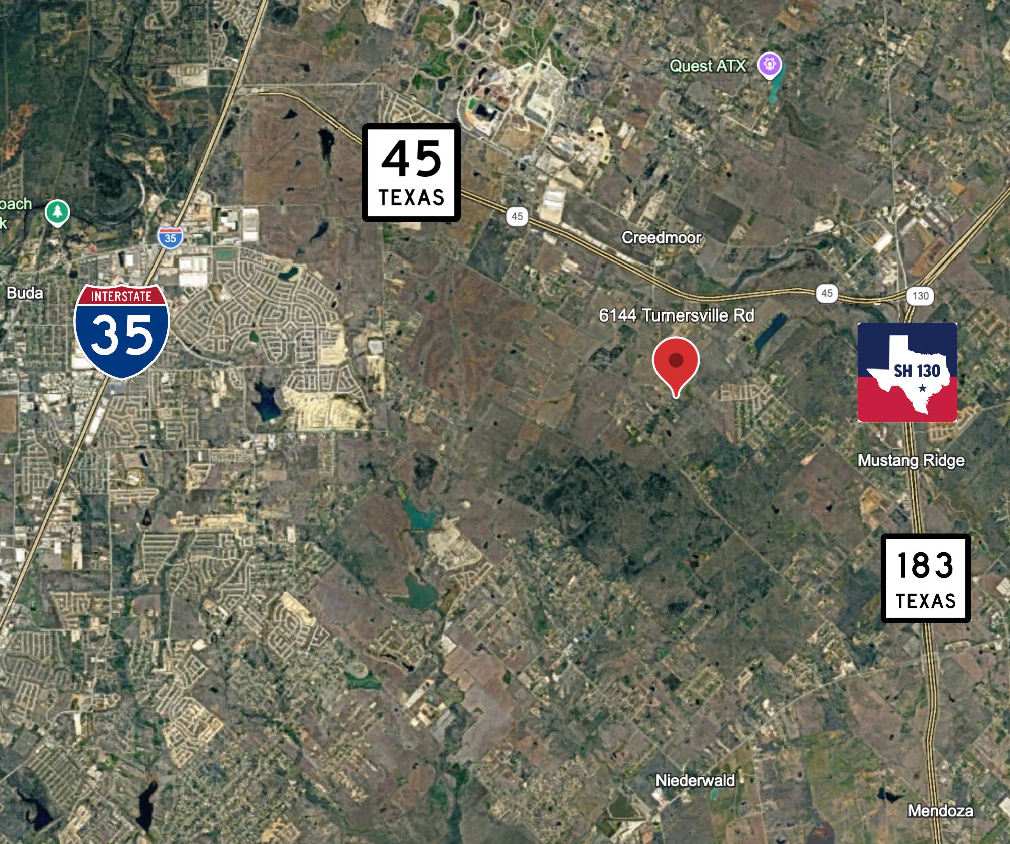 a sign that is sitting on a brick wall