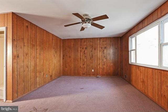 8704 Riggs Road Hyattsville, MD 20783 - Photo 17 of 25 a view of an empty room with a window