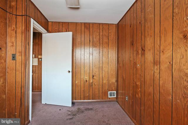 8704 Riggs Road Hyattsville, MD 20783 - Photo 3 of 25 a view of an entryway with wooden wall