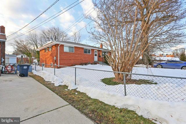 8704 Riggs Road Hyattsville, MD 20783 - Photo 23 of 25 a street view along with residential houses