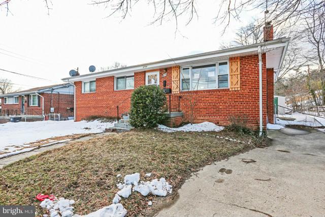 8704 Riggs Road Hyattsville, MD 20783 - Photo 24 of 25 a front view of a house with a yard