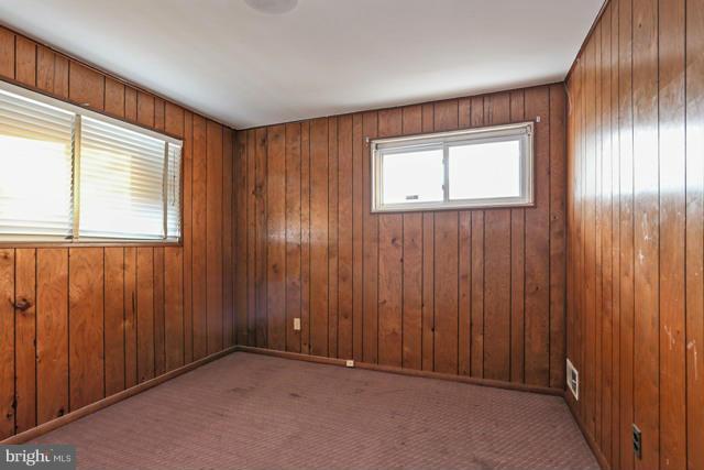 8704 Riggs Road Hyattsville, MD 20783 - Photo 8 of 25 an empty room with windows