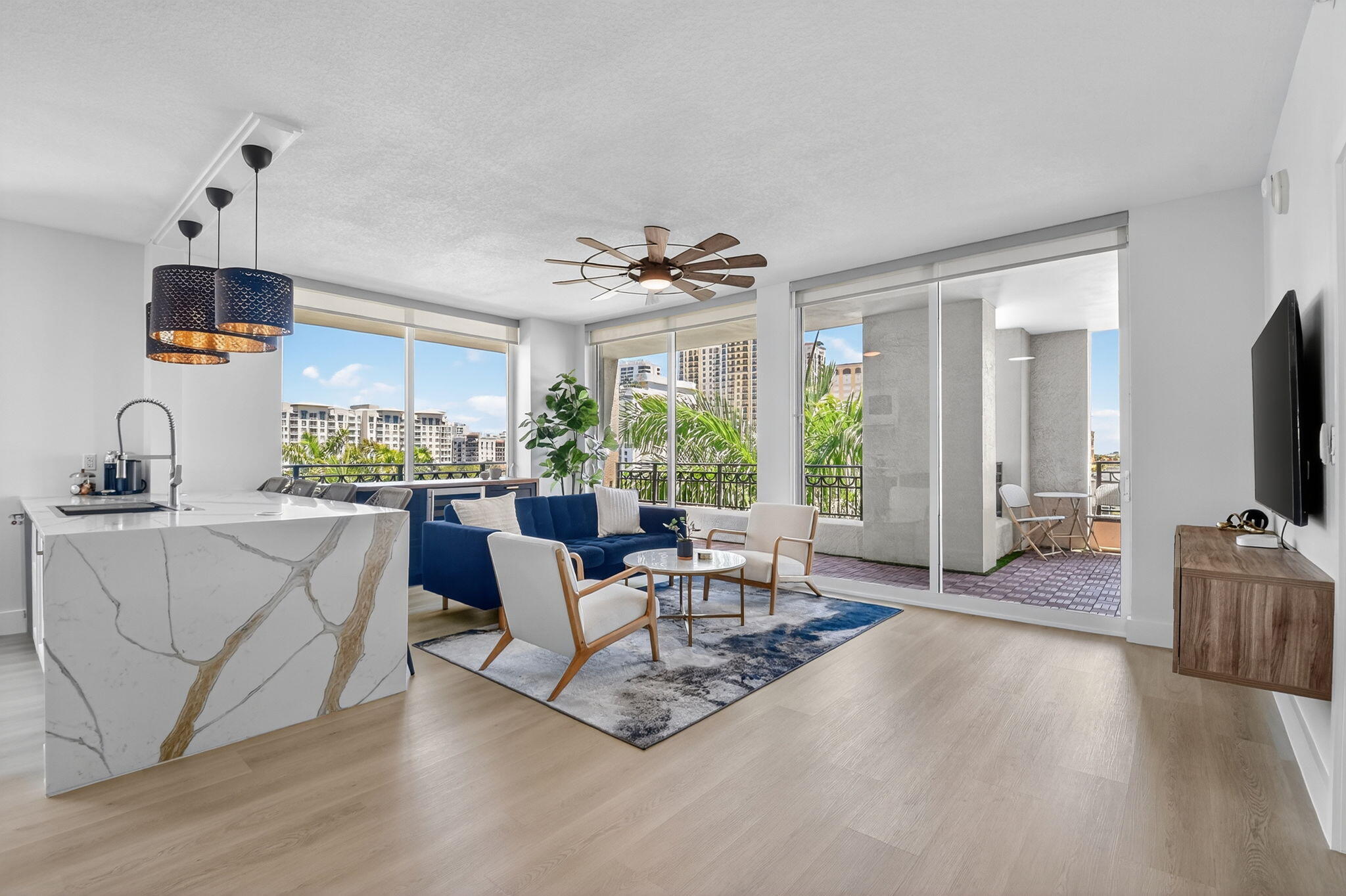 a living room with furniture and a flat screen tv