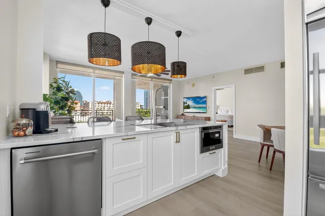 a living room with furniture ceiling fan and a window