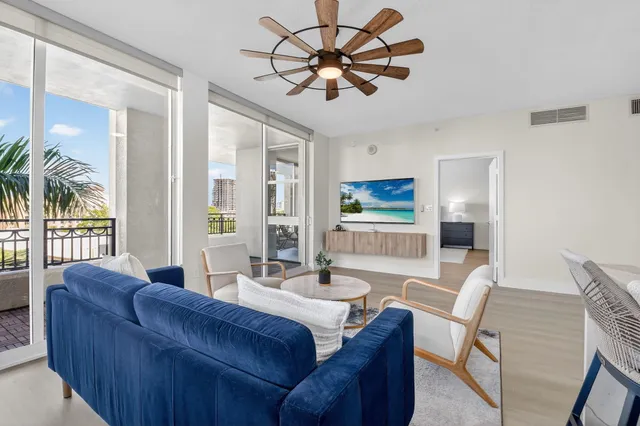 a spacious bedroom with a bed and large windows