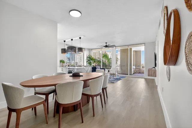 a view of a hallway view with wooden floor and living room