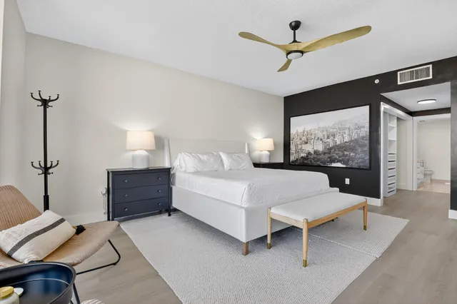 a bedroom with a bed and a couch