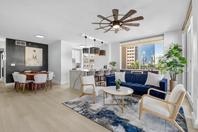 a view of a dining room with furniture and wooden floor