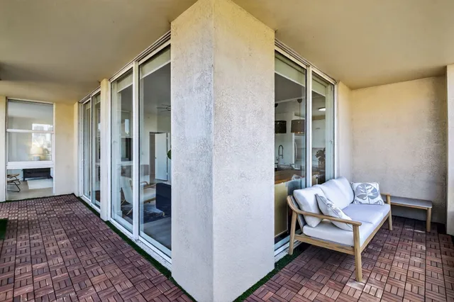 a group of people sitting in front of a cafe