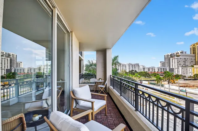 a view of a terrace with chairs and a table
