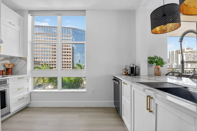 a kitchen with stainless steel appliances granite countertop a stove and a refrigerator