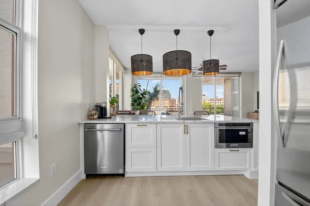 a living room with fireplace furniture and a flat screen tv