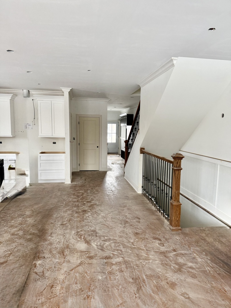 11329 1st Street Mokena, IL 60448 - Photo 13 of 36 a view of a hallway with stairs and a window