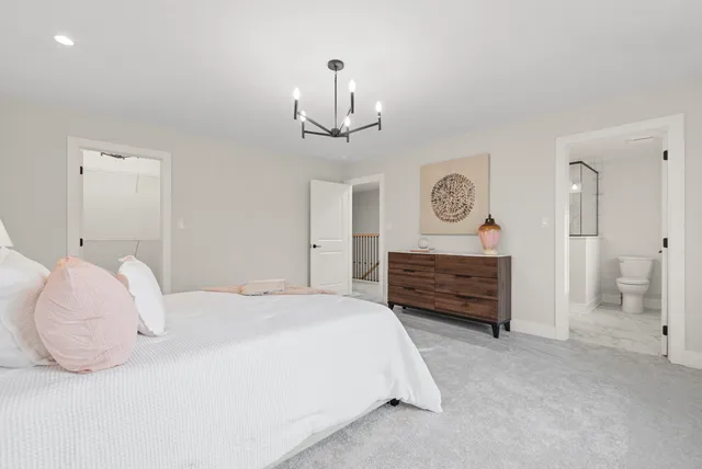 a bedroom with bed and a window