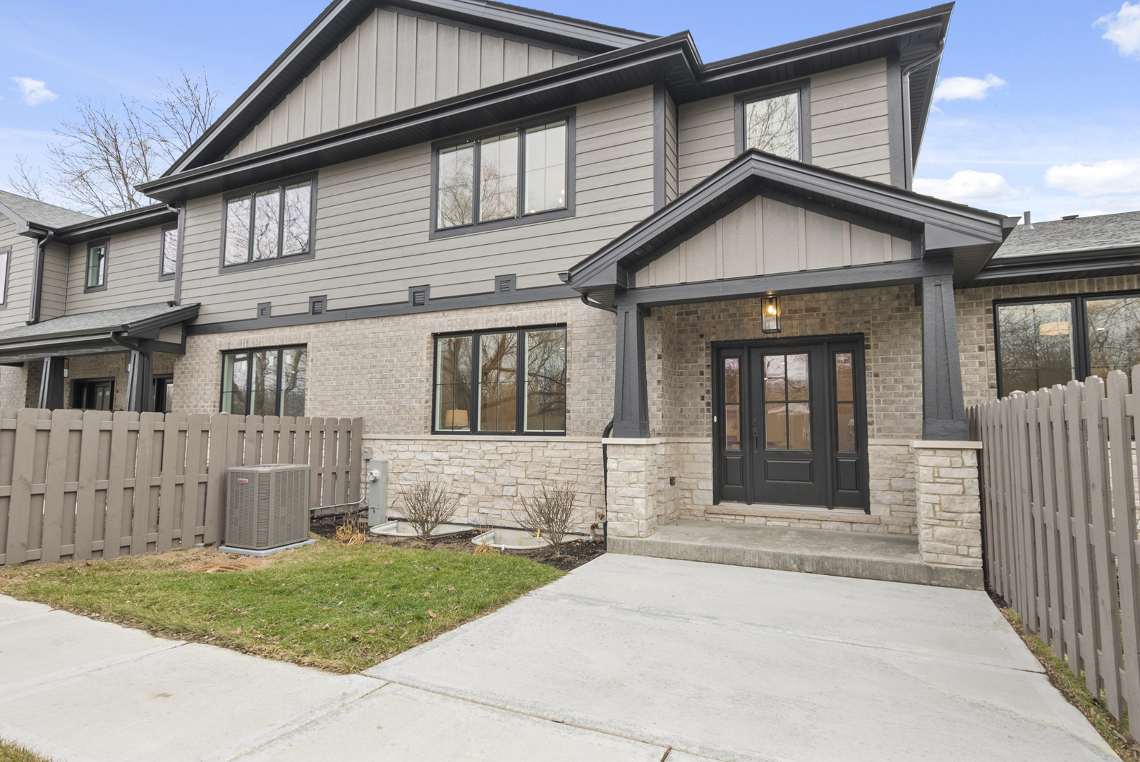 11329 1st Street Mokena, IL 60448 - Photo 3 of 36 a front view of a house with a garden and yard