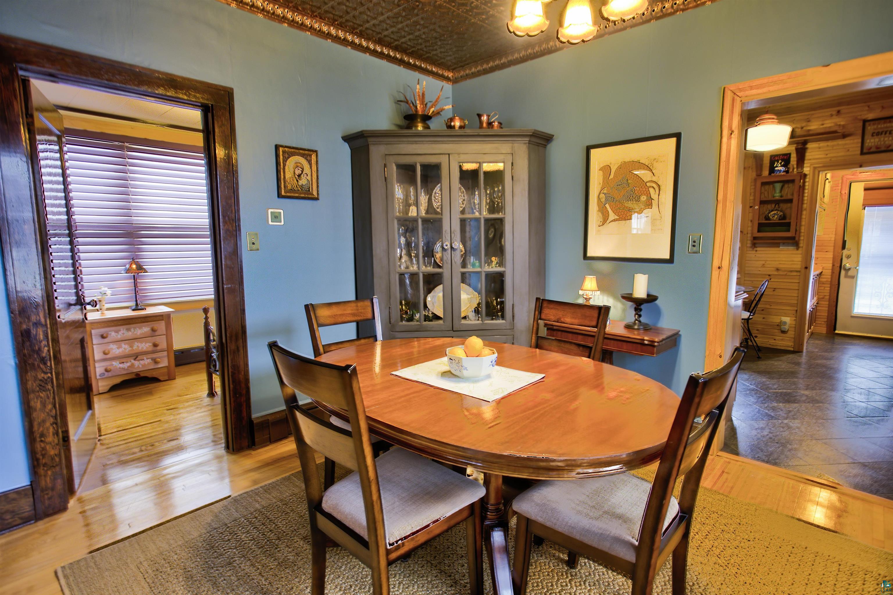24 East Conan Street Ely, MN 55731 - Photo 8 of 27 Dining area with a coffered ceiling and light blue walls