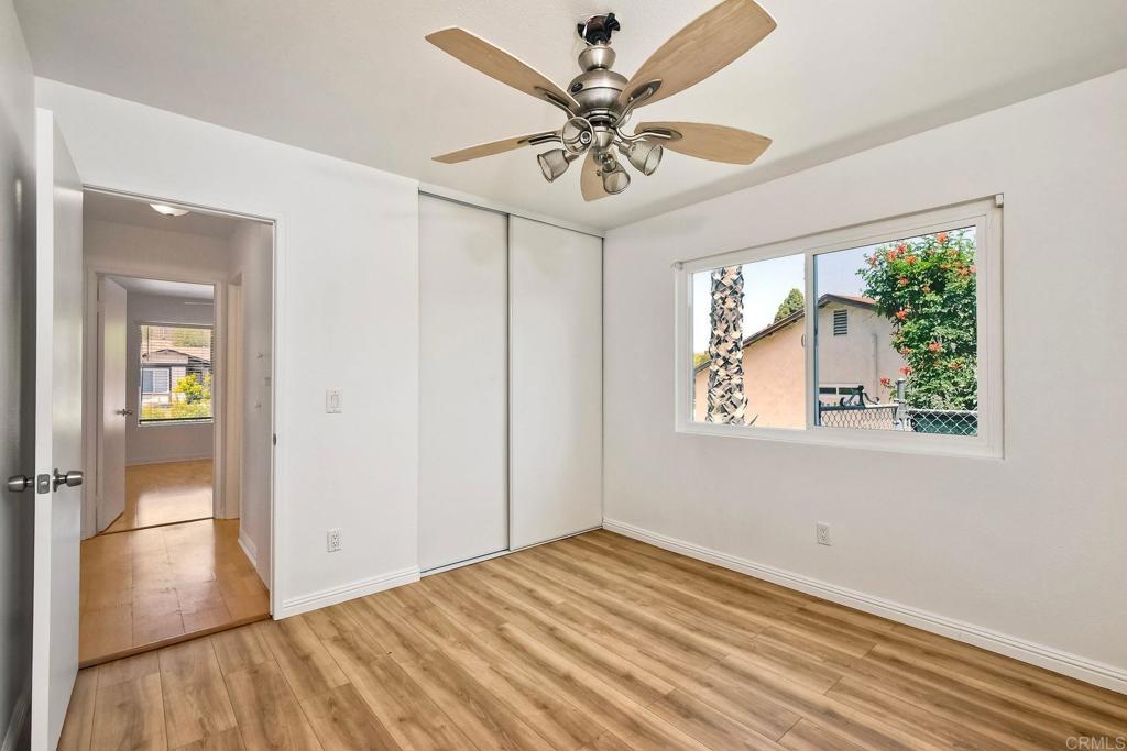 4549 Quailridge Drive Oceanside, CA 92056 - Photo 21 of 25 wooden floor in an empty room with a window