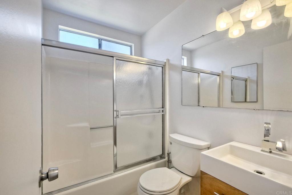 4549 Quailridge Drive Oceanside, CA 92056 - Photo 22 of 25 a bathroom with a sink toilet and shower