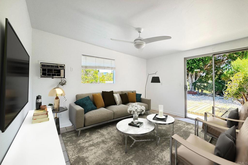 4549 Quailridge Drive Oceanside, CA 92056 - Photo 23 of 25 a living room with furniture and a large window